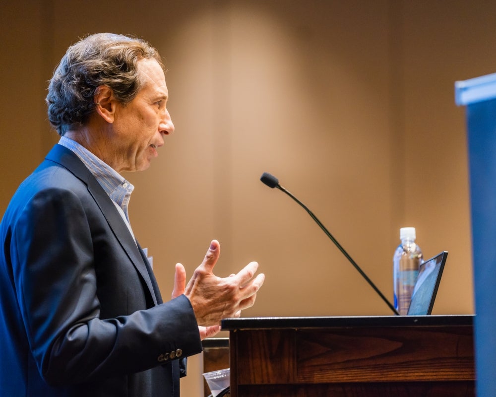 David A. Piacquad speaking at the podium